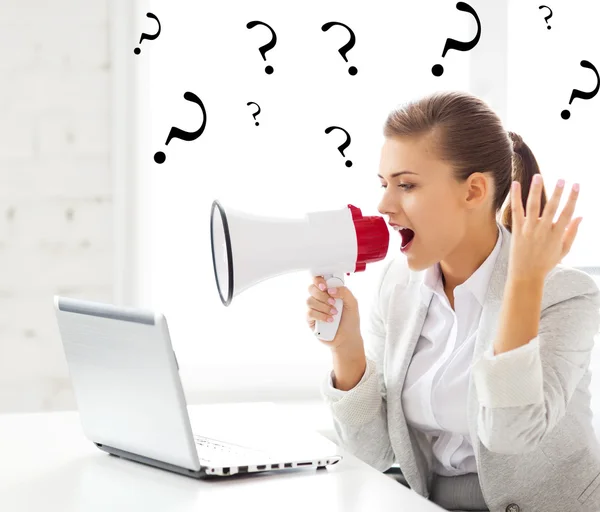 Strict businesswoman shouting in megaphone — Stock Photo, Image