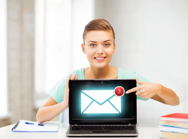 Smiling student girl with laptop at school — Stock Photo, Image