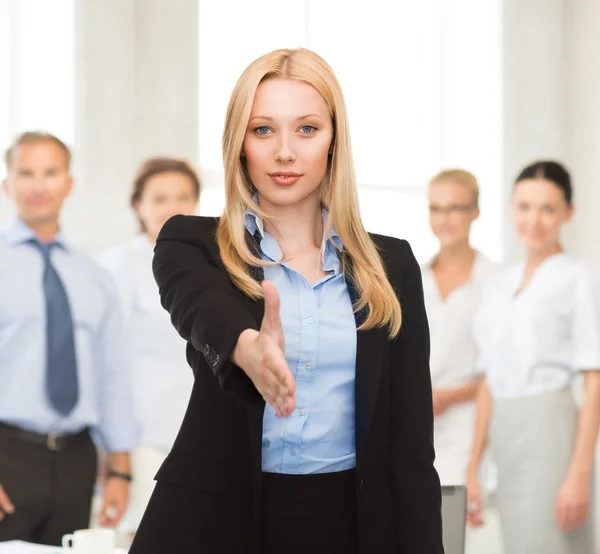 Woman with an open hand ready for handshake — Stock Photo, Image