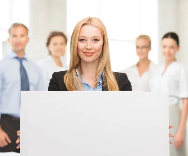 Businesswoman with white blank board — Stock Photo, Image