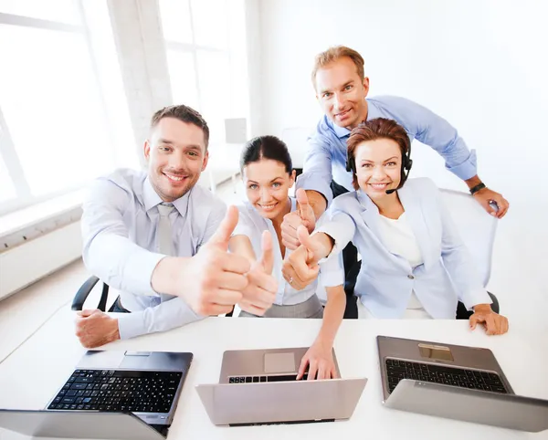 Group of office workers showing thumbs up — Stock Photo, Image