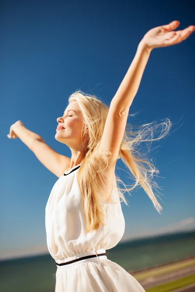 Beautiful woman enjoying summer outdoors Royalty Free Stock Images