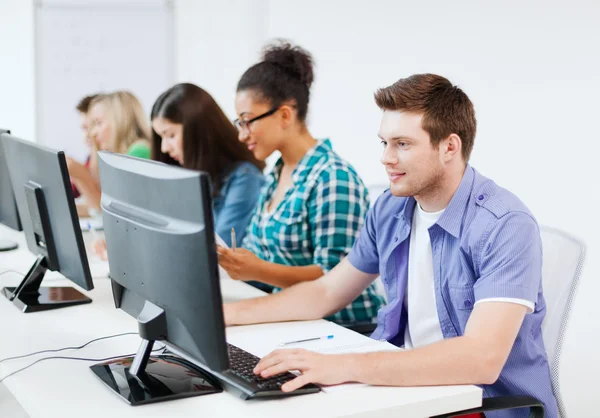 Student with computer studying at school — Stock Photo, Image