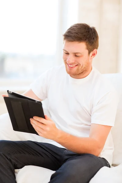 Man working with tablet pc at home — Stock Photo, Image