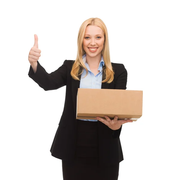 Businesswoman holding cardboard box — Stock Photo, Image