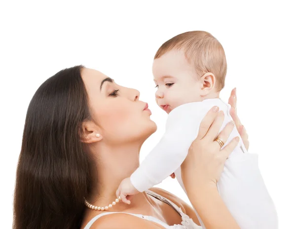 Happy mother kissing her child — Stock Photo, Image