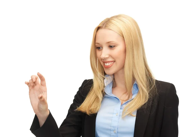 Businesswoman working with something imaginary — Stock Photo, Image