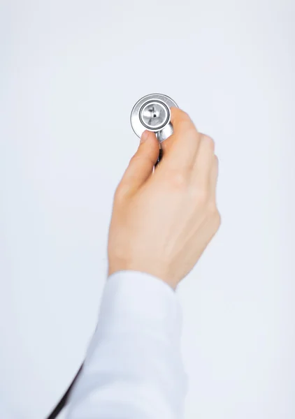 Doctor hand with stethoscope listening somebody — Stock Photo, Image