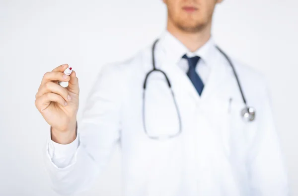 Doctor writing something in the air — Stock Photo, Image