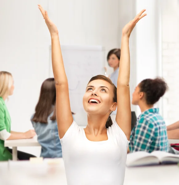 Happy student girl with hands up — Stock Photo, Image