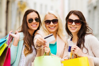 Girls with shopping bags in ctiy clipart
