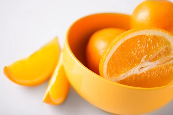 Sliced orange in a bowl — Stock Photo, Image