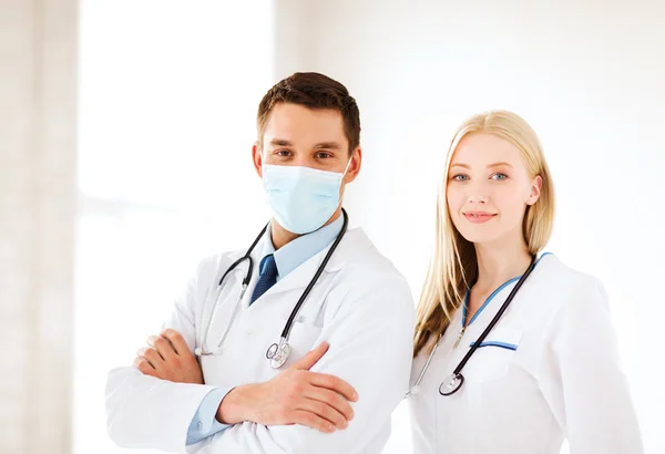 Two young attractive doctors — Stock Photo, Image