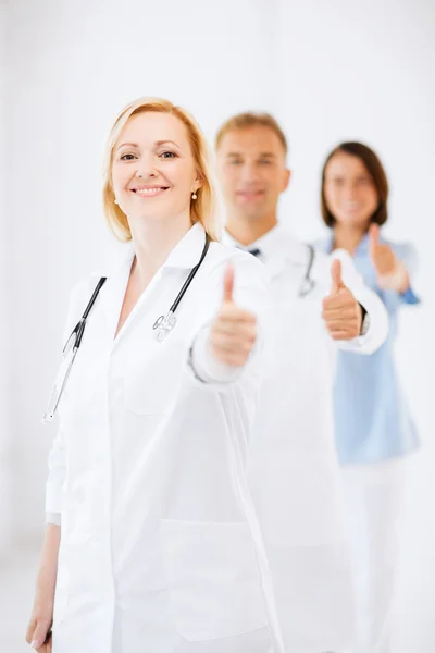 Team of doctors showing thumbs up — Stock Photo, Image
