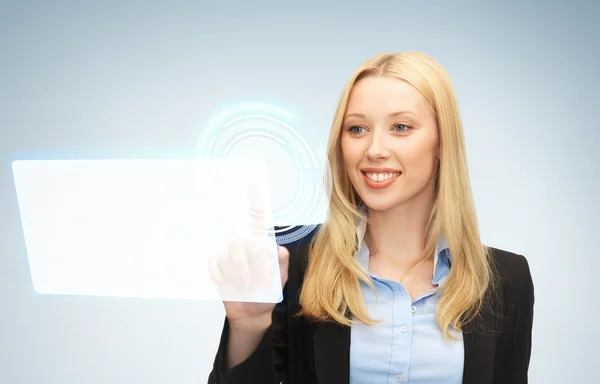 Businesswoman touching virtual screen — Stock Photo, Image