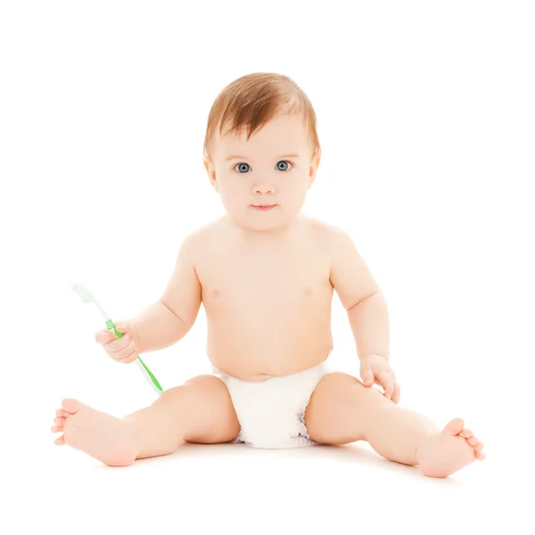 Curioso bebé cepillarse los dientes —  Fotos de Stock