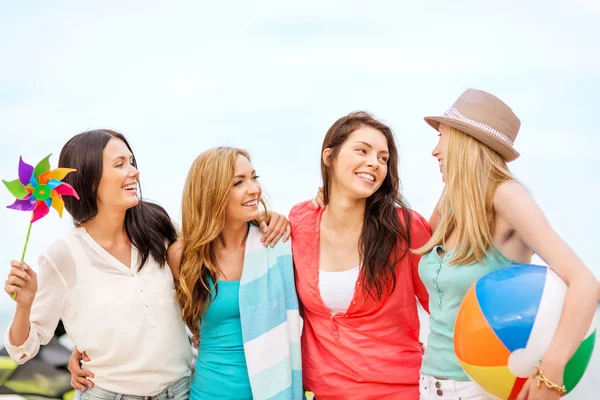 Girls with ball on the beach Stock Photo