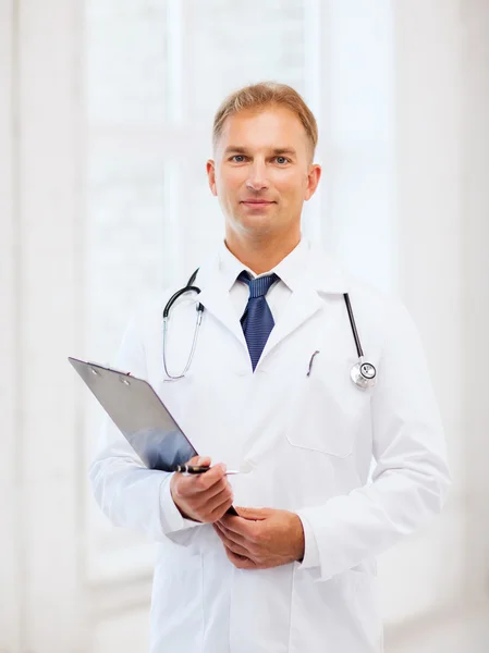 Male doctor with stethoscope and clipboard Stock Image