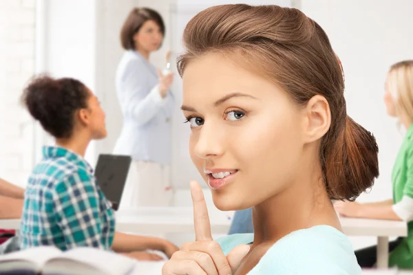 Student making hush gesture at school — Stock Photo, Image