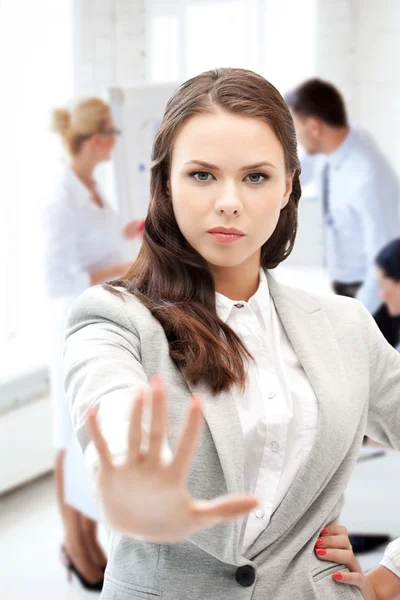 Angry businesswoman showing stop gesture — Stock Photo, Image