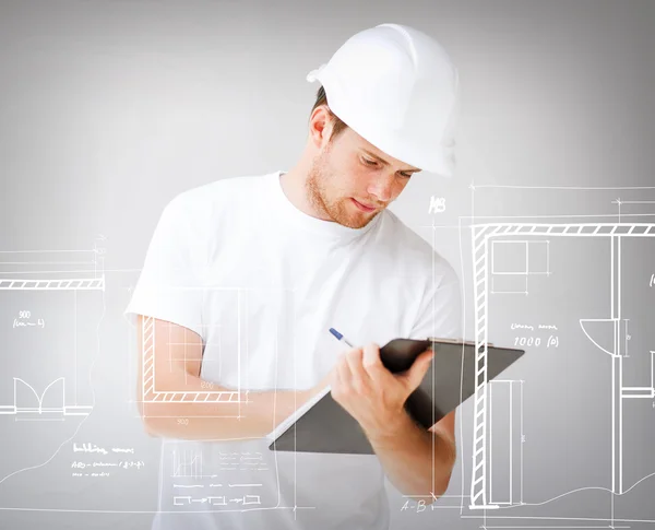 Male architect looking at blueprint — Stock Photo, Image