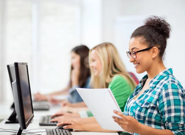 African student with computer studying at school — Stock Photo, Image