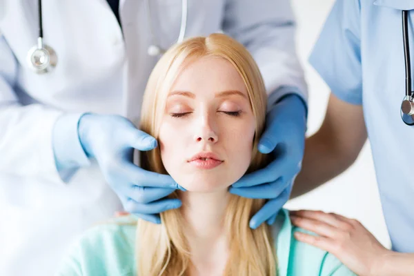 Plastic surgeon or doctor with patient — Stock Photo, Image