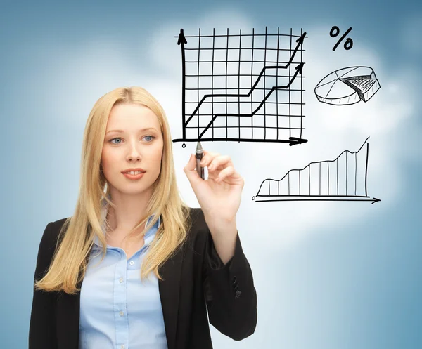 Businesswoman drawing graphs in the air — Stock Photo, Image