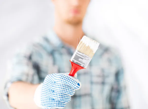 Man hand with paintbrush — Stock Photo, Image