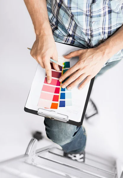 Man with color samples for selection — Stock Photo, Image