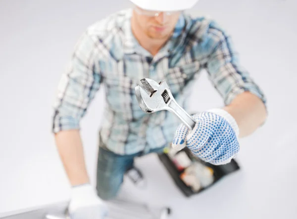 Man with ladder, toolkit and spanner — Stock Photo, Image