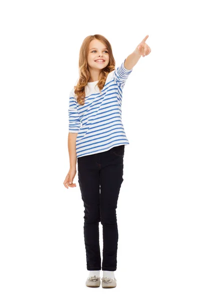 Flickan pekar på imaginära skärm — Stockfoto