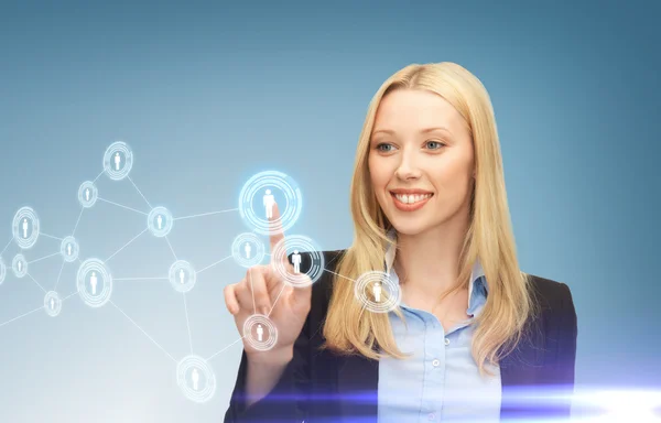 Businesswoman pressing button with contact — Stock Photo, Image