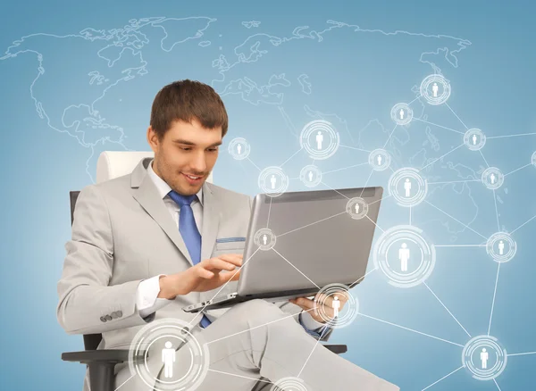 Businessman networking with laptop — Stock Photo, Image