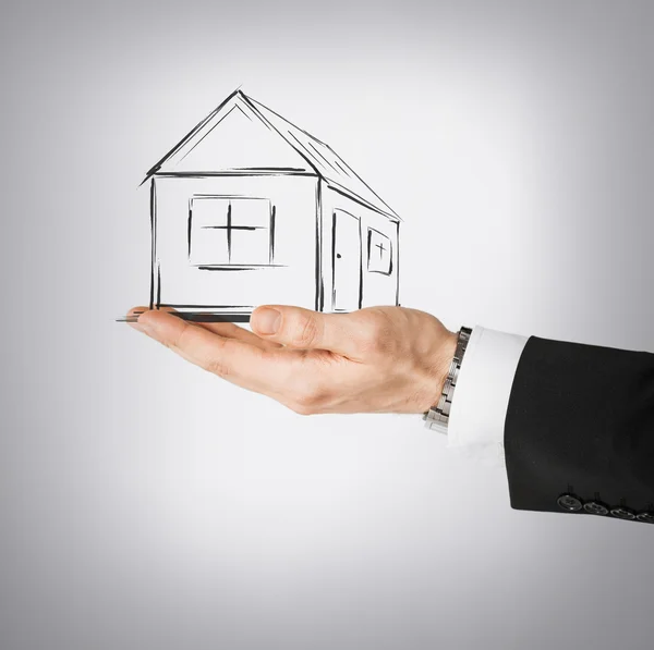 House on virtual screen in man hand — Stock Photo, Image
