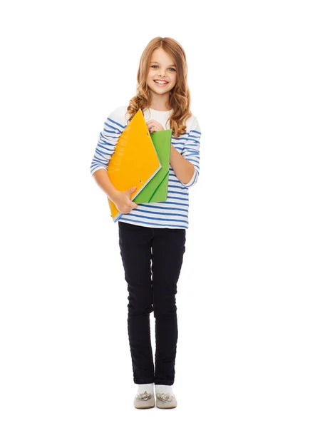 Çocuk holding renkli klasörler — Stok fotoğraf