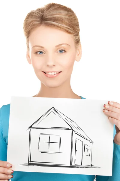 Mulher segurando foto com casa — Fotografia de Stock