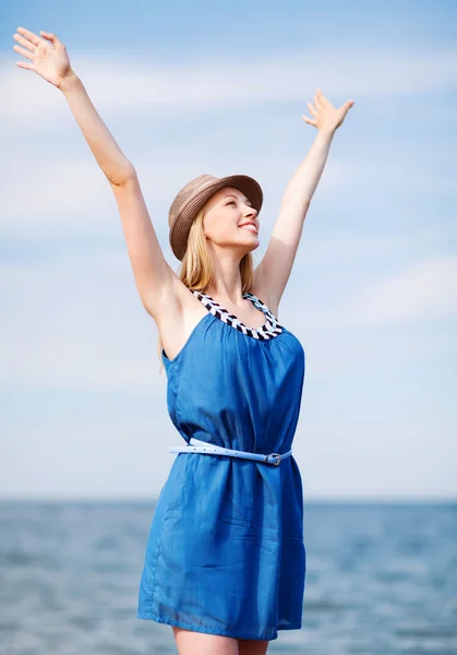 Girl with hands up on the beach Royalty Free Stock Photos