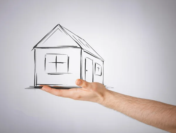 House on virtual screen in man hand — Stock Photo, Image