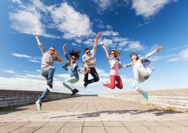 Group of teenagers jumping clipart