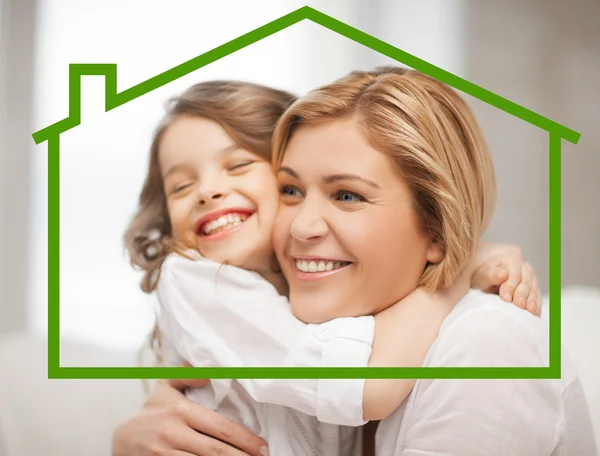 Mother and daughter with eco house — Stock Photo, Image