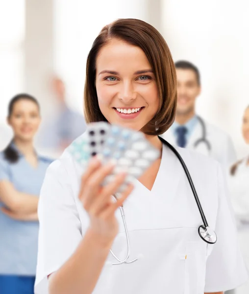 Doctor with blister packs of pills — Stock Photo, Image