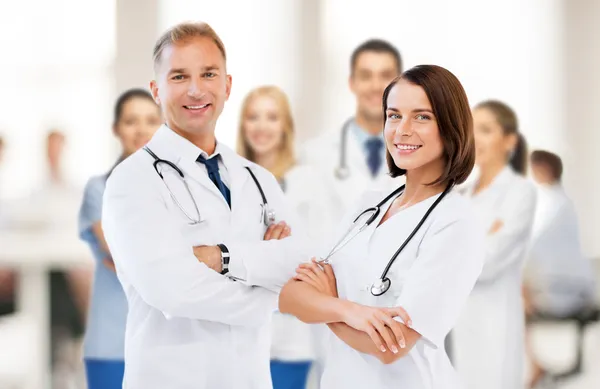 Two young attractive doctors — Stock Photo, Image