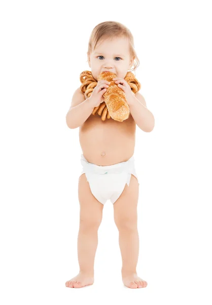 Cute todler eating long bread — Stock Photo, Image