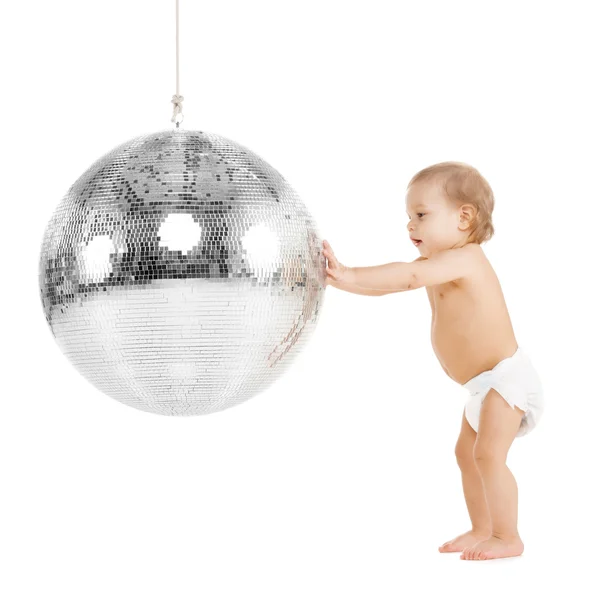 Toddler playing with disco ball — Stock Photo, Image