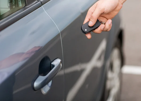 Man with car key outside Stock Image