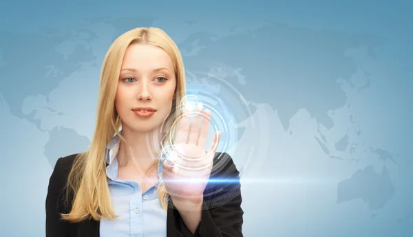 Businesswoman touching virtual screen — Stock Photo, Image