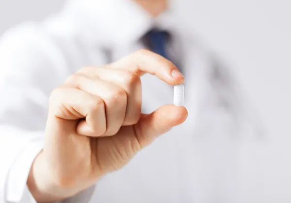 Doctor with pill in hospital — Stock Photo, Image