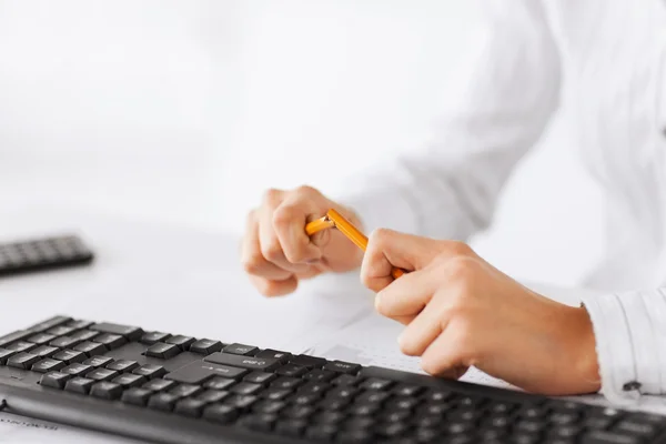 Woman breaking pencil — Stock Photo, Image