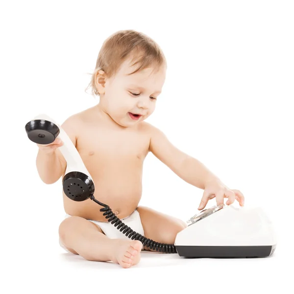 Criança curiosa brincando com telefone — Fotografia de Stock